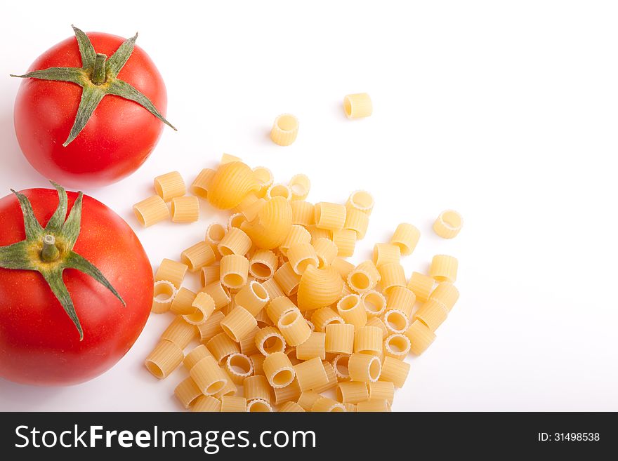 Raw pasta with cherry tomatoes with white space for your text here