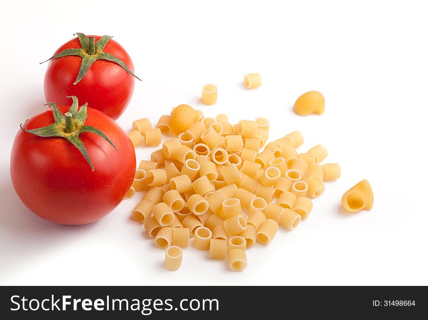 Raw pasta with cherry tomatoes with white space for your text here