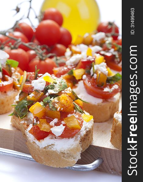 Appetizer called Bruschetta with cheese and vegetables