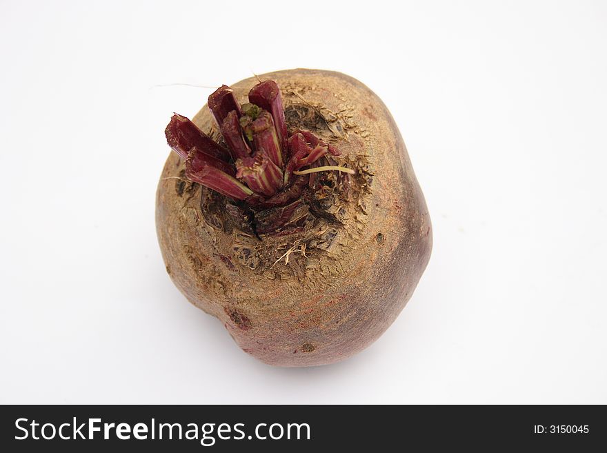 On a photo a red beet. The photo is isolated