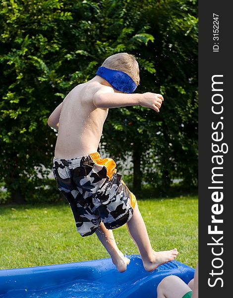 Child jumping to a swimming pool. Child jumping to a swimming pool