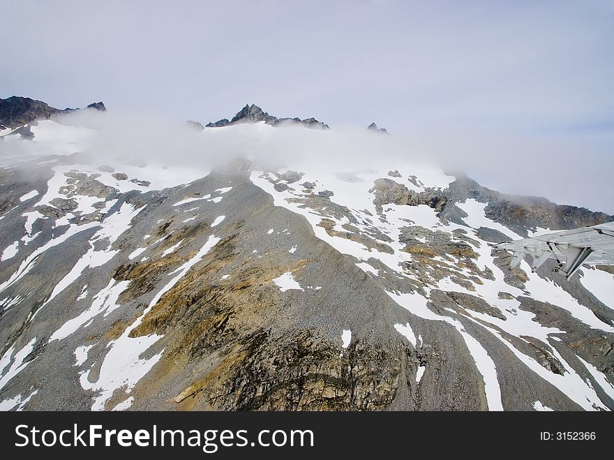 Mountains And Clouds In Alaska