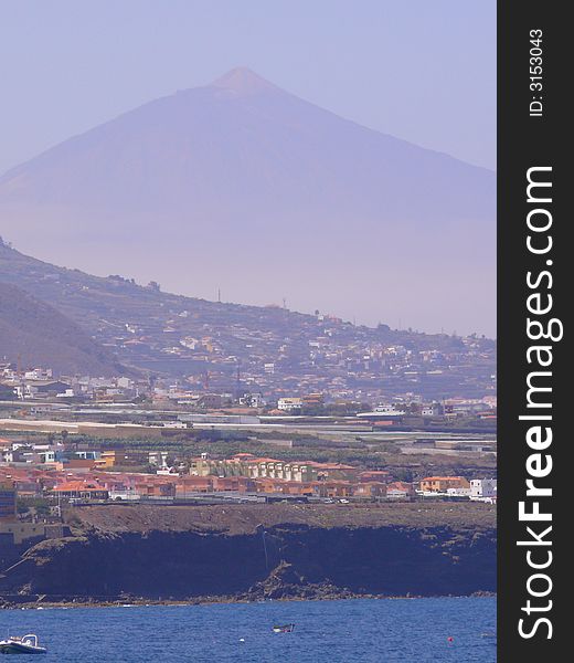 View from Bajamar touristic resort to the volcan Teide looming at the background at 12000 feet. View from Bajamar touristic resort to the volcan Teide looming at the background at 12000 feet