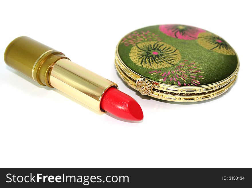 Red lipstick and double closed cosmetic mirror isolated on white. Red lipstick and double closed cosmetic mirror isolated on white