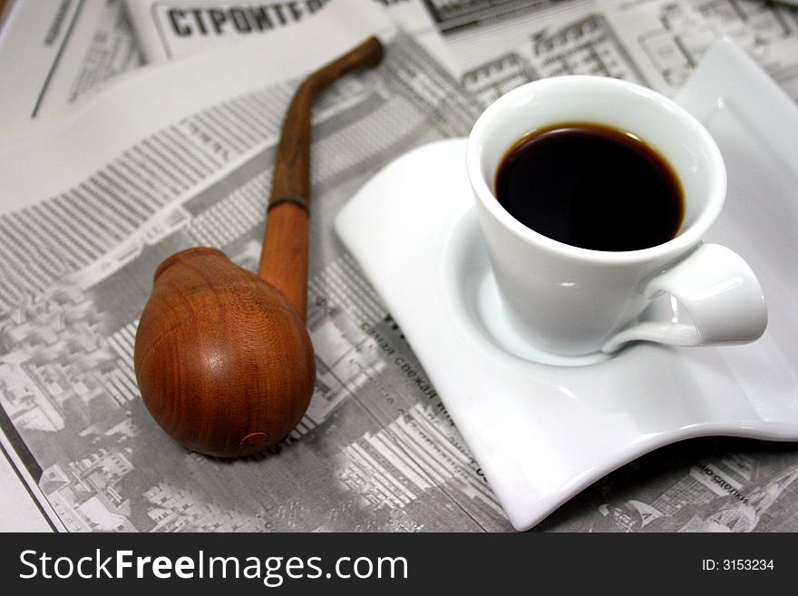 Coffee, newspaper and pipe