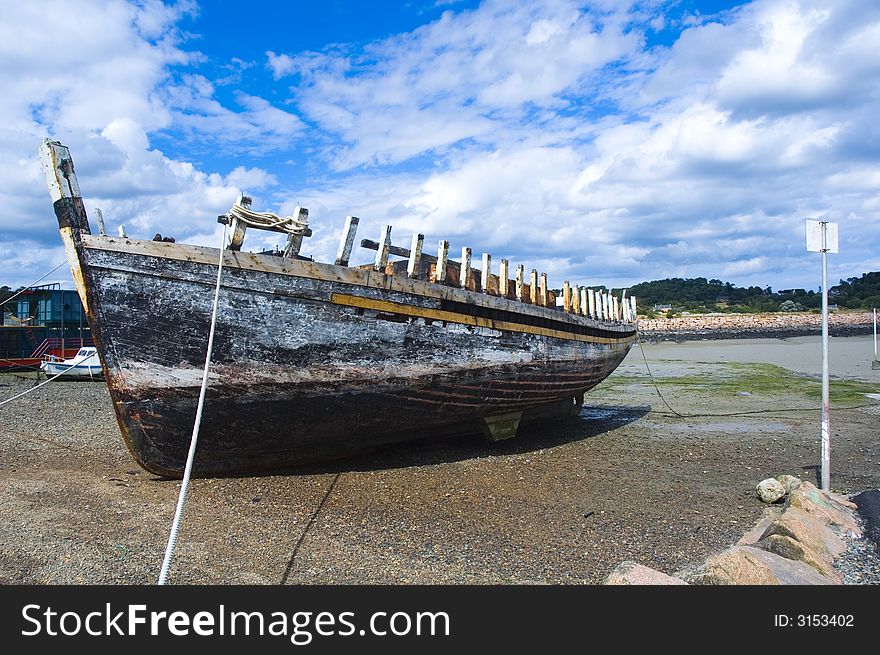 A shipwreck lying in a harbour to be restored