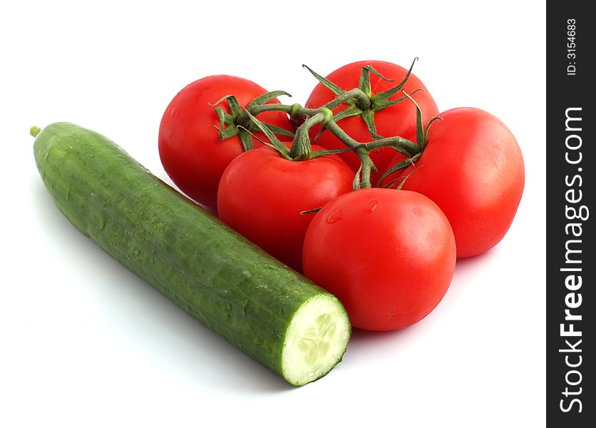 Cucumber and tomato bunch isolated on white background. Cucumber and tomato bunch isolated on white background