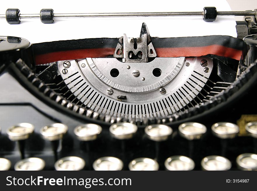 A close up photo of very old typewriter