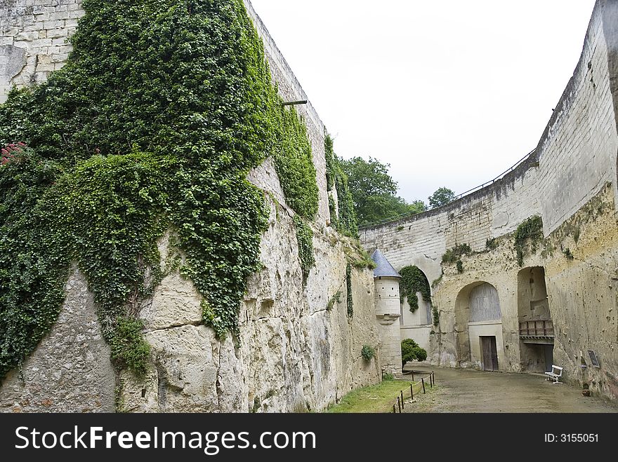 At the bottom of the deep rocky moat of chateau (castle) BreÌzeÌ, Loire Valley, France. At the bottom of the deep rocky moat of chateau (castle) BreÌzeÌ, Loire Valley, France