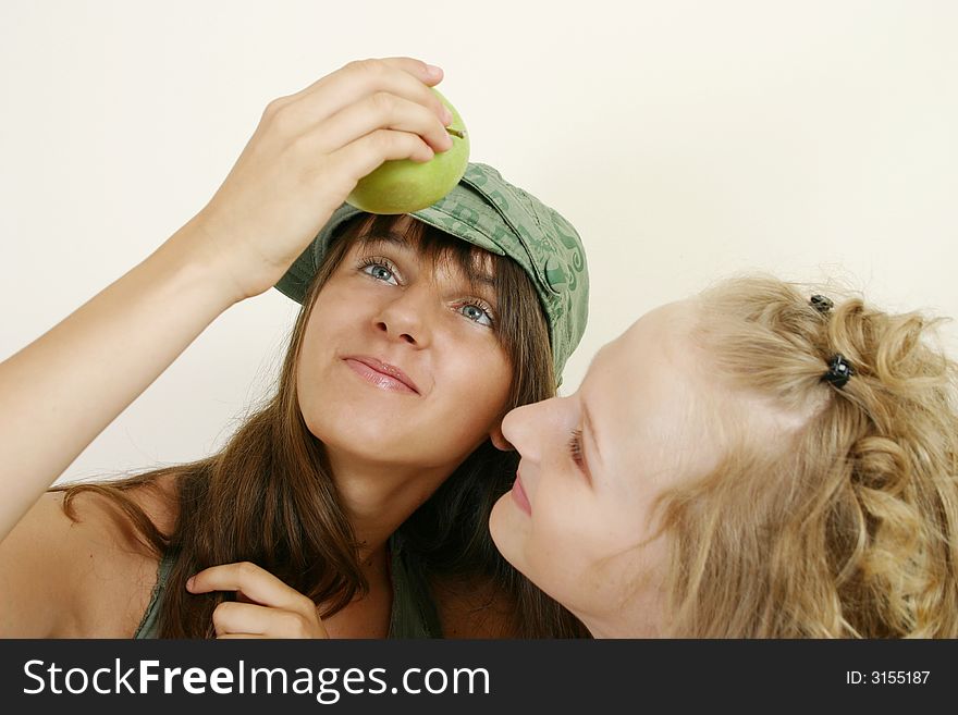 Portrait image of two young girls with apple. Portrait image of two young girls with apple