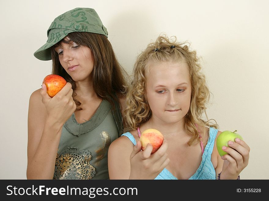 Portrait image of two young girls with apple. Portrait image of two young girls with apple