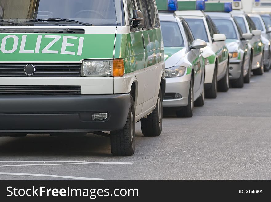 Police vehicles near to a police station. Germany, Munich. Clipping path. Police vehicles near to a police station. Germany, Munich. Clipping path.