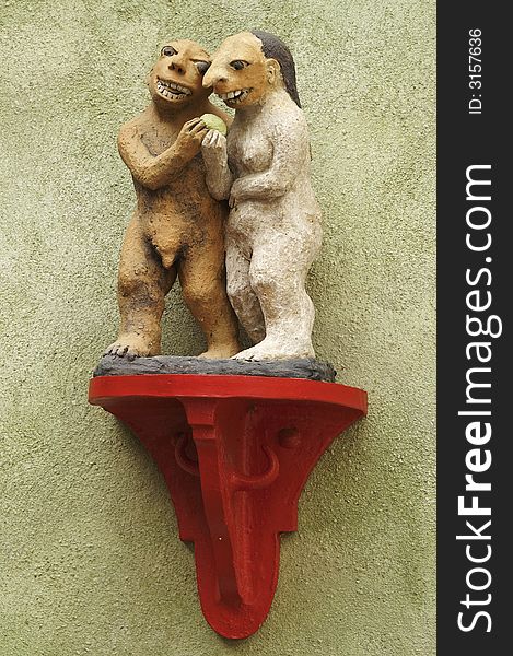 Cesky Krumlov. Adam and Eve, sculptural decoration on the wall at home