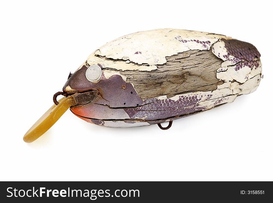 Old fishing lure isolated on white.