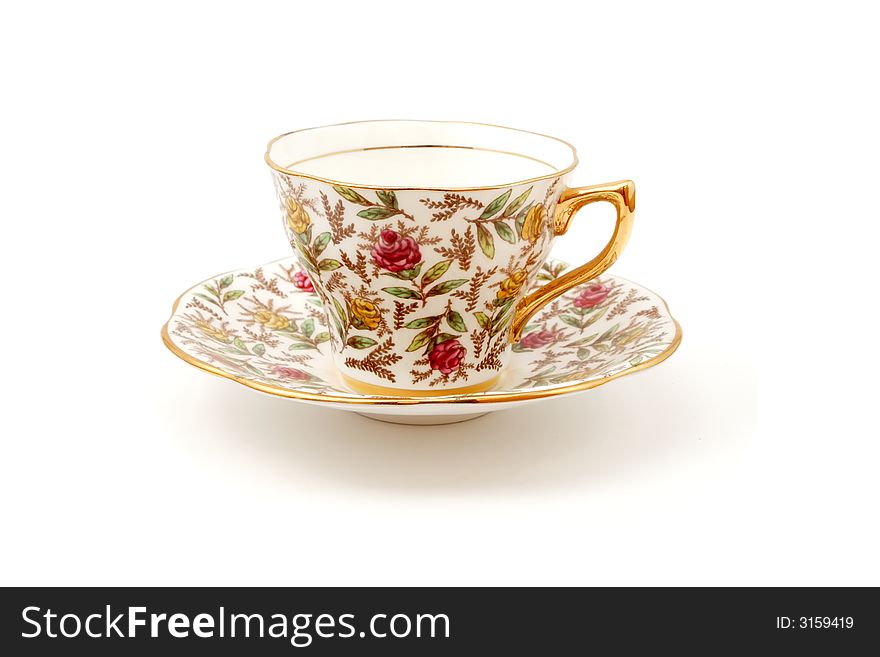 Tea cup with flower pattern on white background. Tea cup with flower pattern on white background