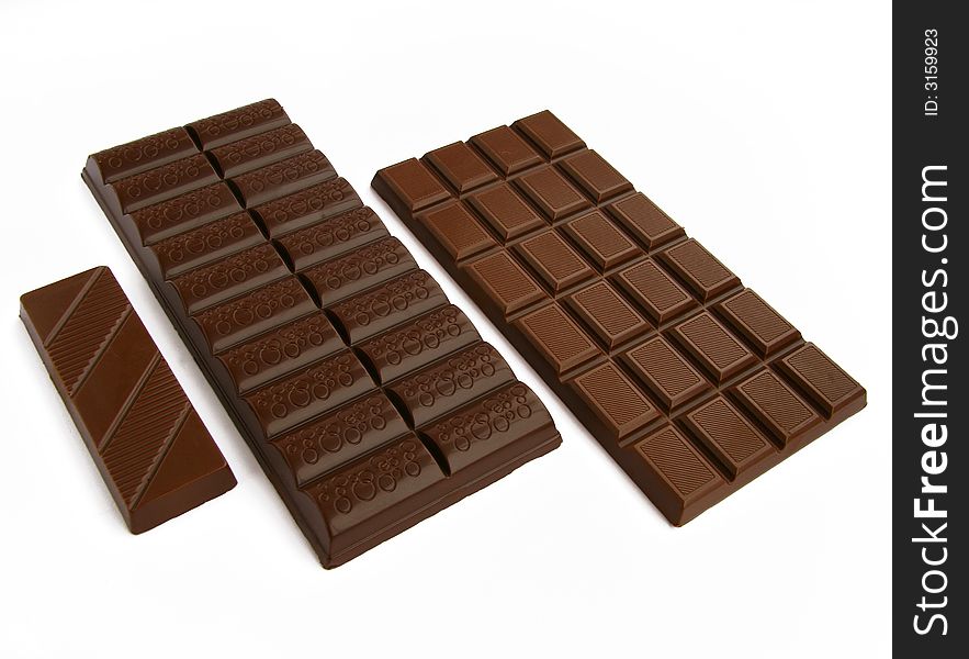 Three chocolate tiles on a white background. Three chocolate tiles on a white background.