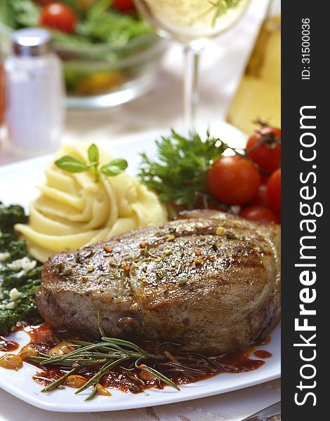 Delicious beef steak with spaniard and potatoes