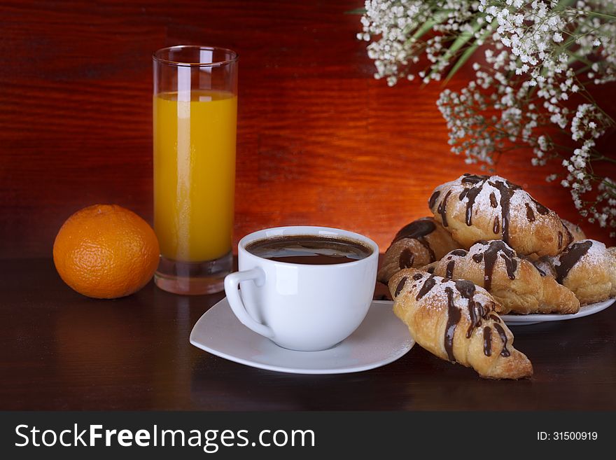 Coffee, croissant and orange juice. Coffee, croissant and orange juice