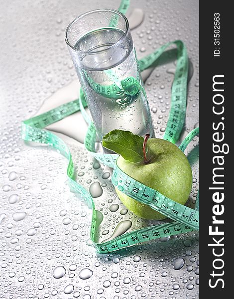 Healthy concept - apple glass of water and tape. Healthy concept - apple glass of water and tape