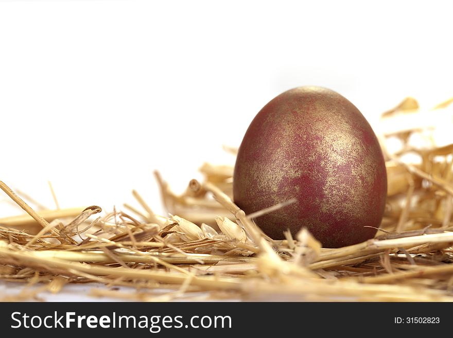 Close-up portrait of red and golden egg. Close-up portrait of red and golden egg