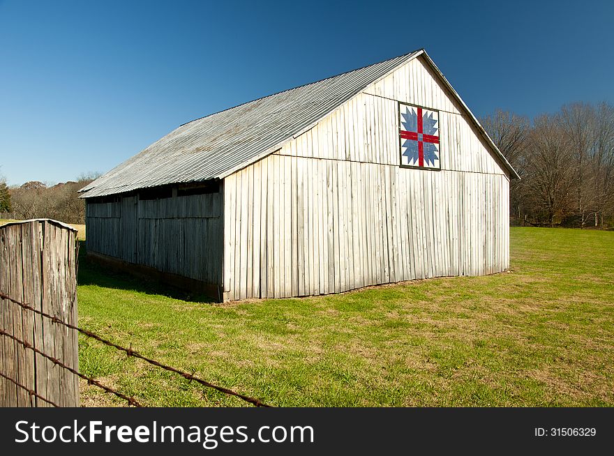 An old barn with a classic quilt block.