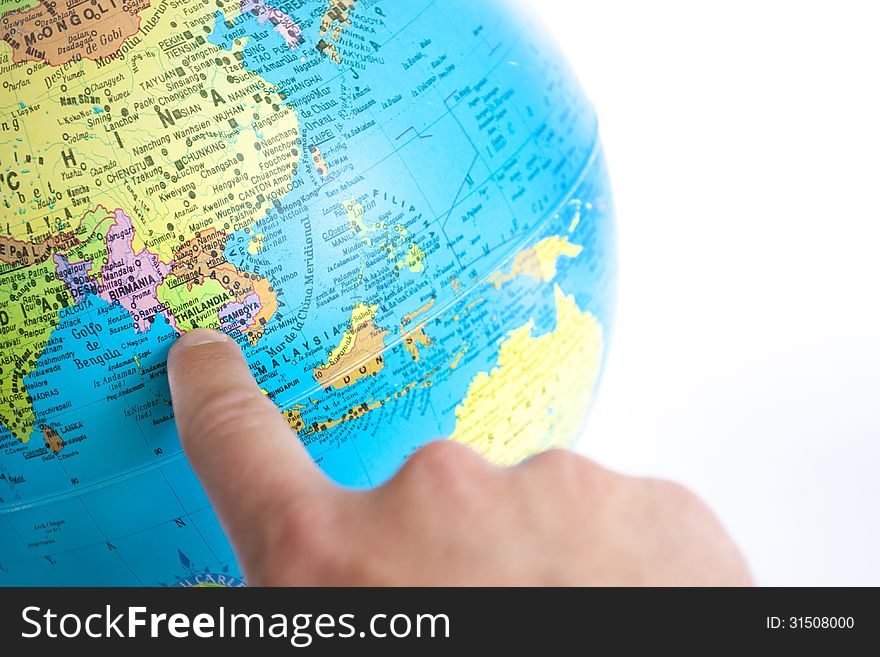 Thailand index finger pointing in a world globe on white background. Thailand index finger pointing in a world globe on white background