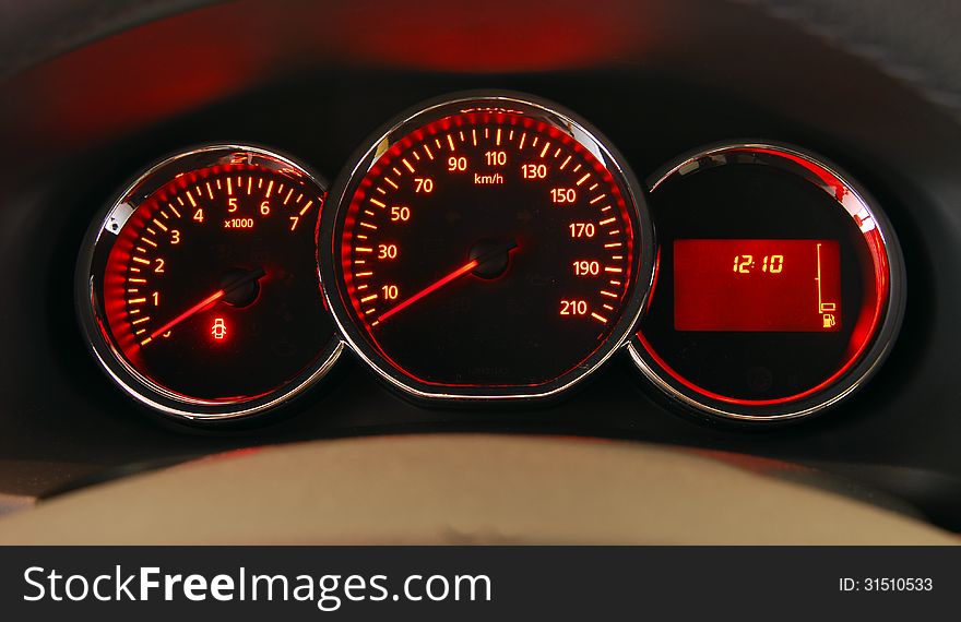 Modern car illuminated dashboard closeup