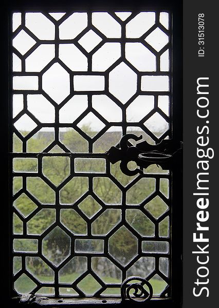 View through a very old window. View through a very old window