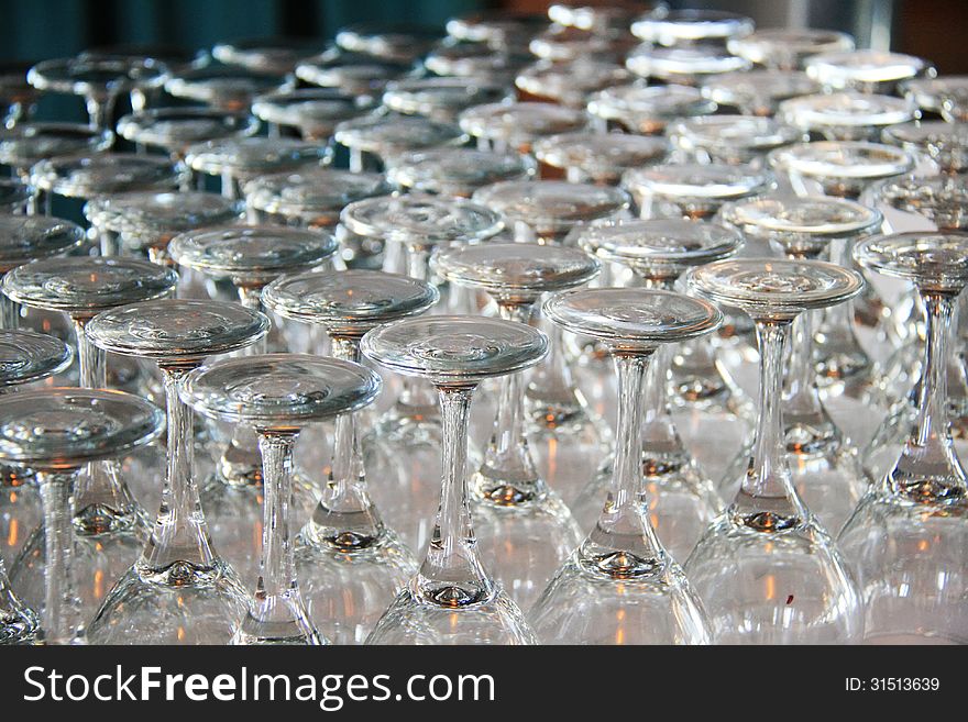 Rows of Empty Wine Glasses on the table ready for guests