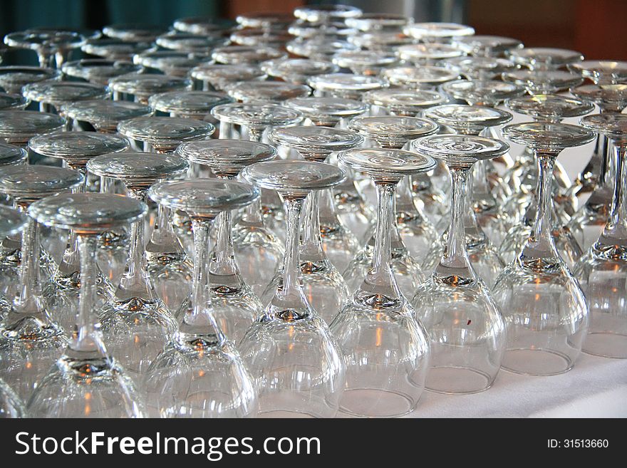 Rows of Empty Wine Glasses on the table ready for guests