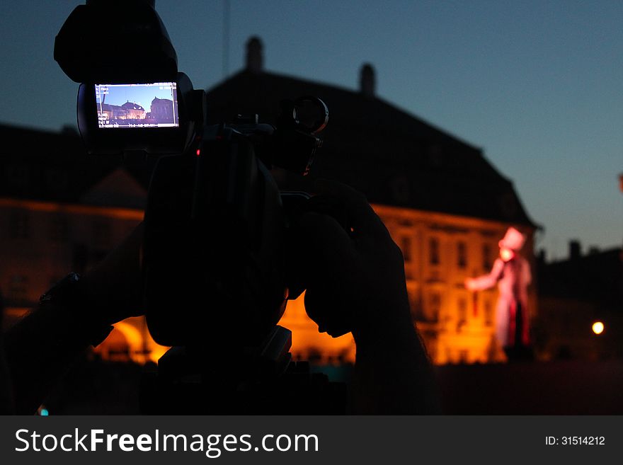 Video camera viewfinder - recording located outdoor in the night on a street. Video camera viewfinder - recording located outdoor in the night on a street.