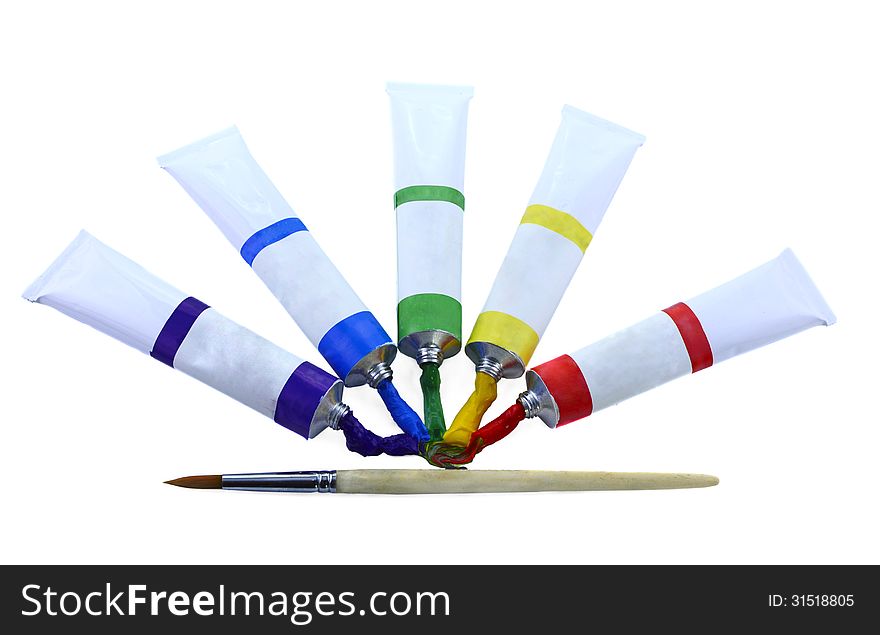 Five paint tubes and single wooden brush isolated. Five paint tubes and single wooden brush isolated