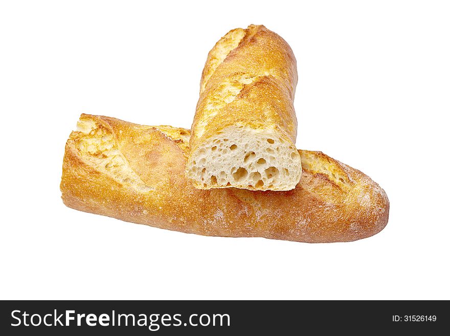 Fresh Crusty the cut baguettes on a wooden background.