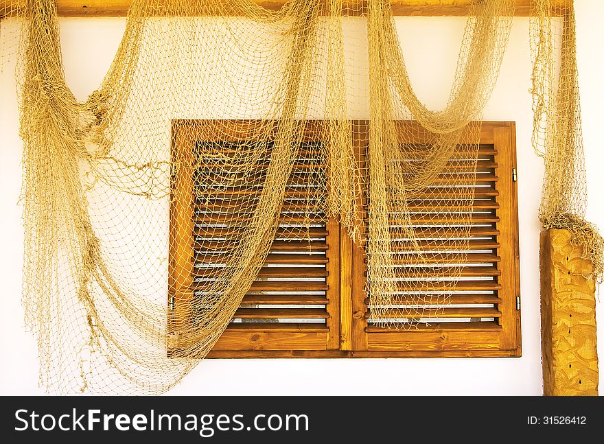 Fishing nets on a house wall