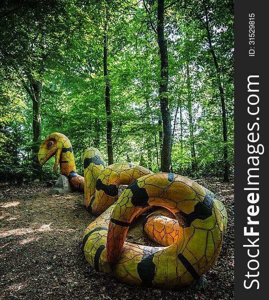 A yellow and black concrete snake