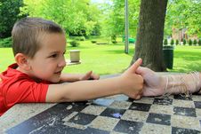 Young Boy Determined To Beat His Mom At Thumb Wrestling Stock Photography Young Boy Determined To Beat His Mom At Thumb Wrestling Stock Photography