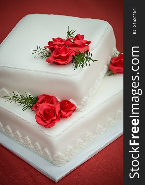 Wedding cake on a red tablecloth