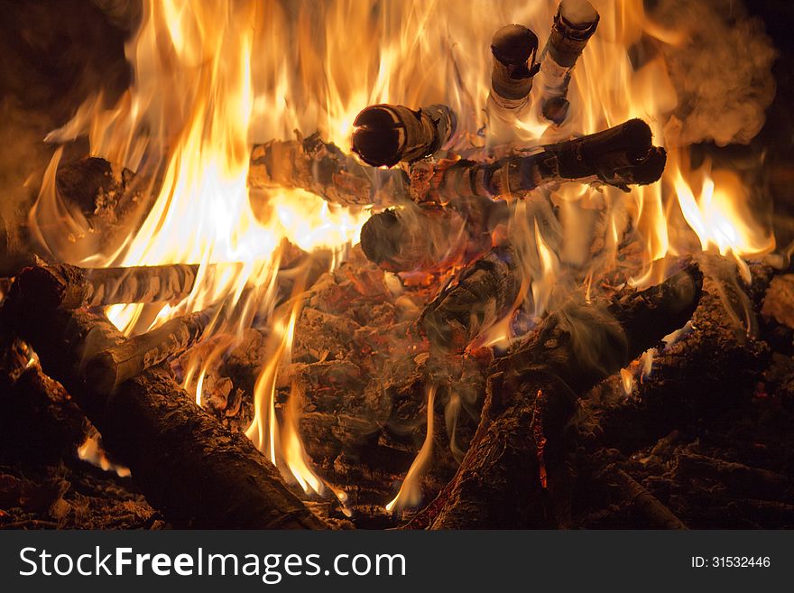 Burning logs on a campfire. Burning logs on a campfire