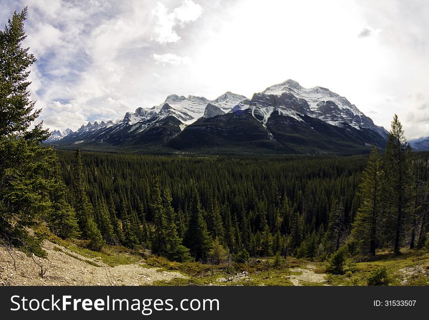 Canadian rocky mountains in the Spring thru a fisheye lens. Canadian rocky mountains in the Spring thru a fisheye lens