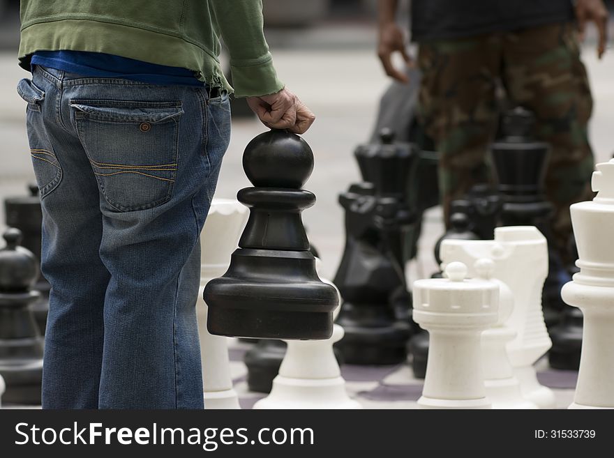 Man Moves Piece People Playing Giant Chess Game Sidewalk Downtow