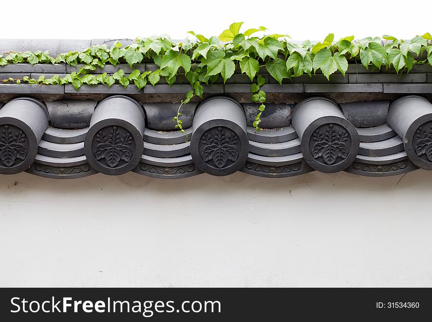 Japanese style white wall with roofing tiles. Japanese style white wall with roofing tiles