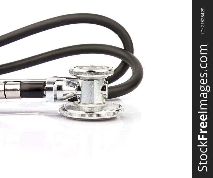 Metallic stethoscope on white background, medical equipment photo