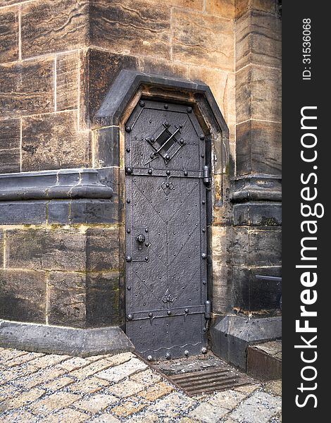 Old metal door to the St.Vitus church in Prague.Czech republic. Old metal door to the St.Vitus church in Prague.Czech republic.