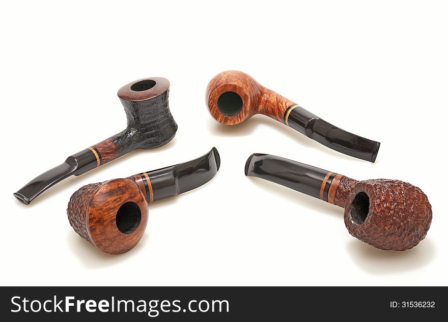 Tobacco pipes on a white background.