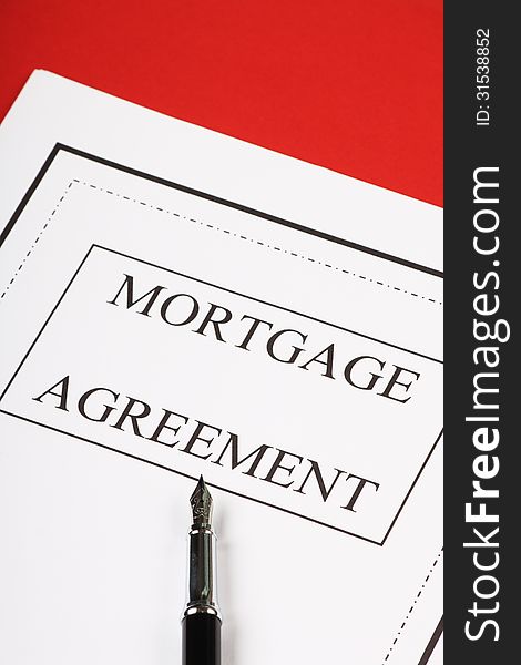 A mortgage agreement or contract ready for signature with a fountain pen