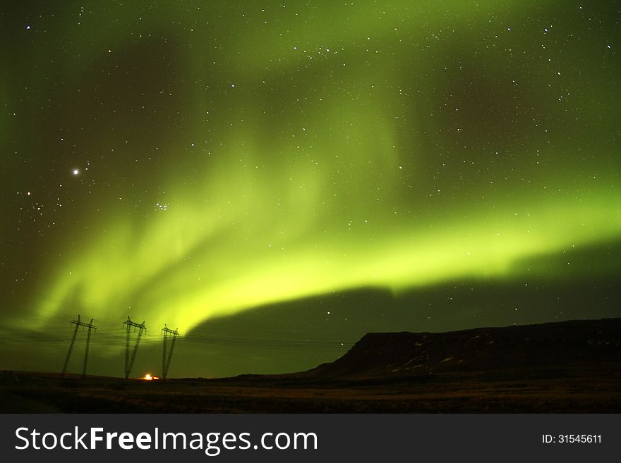 The solar winds activating the Northern lights producing a wonderful light show. The solar winds activating the Northern lights producing a wonderful light show