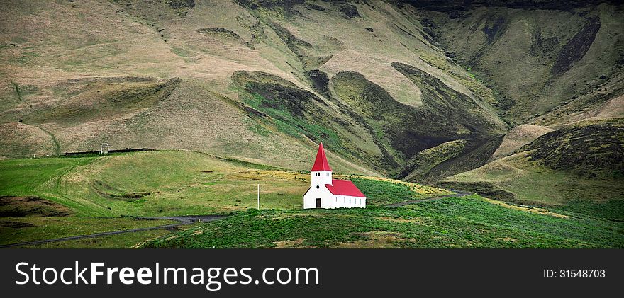 Single icelandic white church in field near Vik. Single icelandic white church in field near Vik