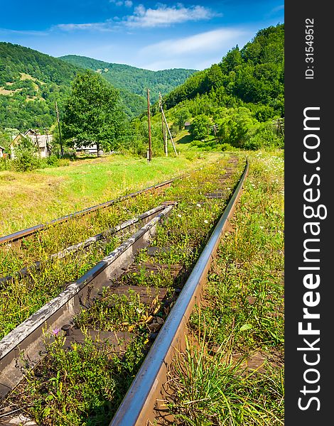 Railway Sneaking Through Mountain Near The Wilage