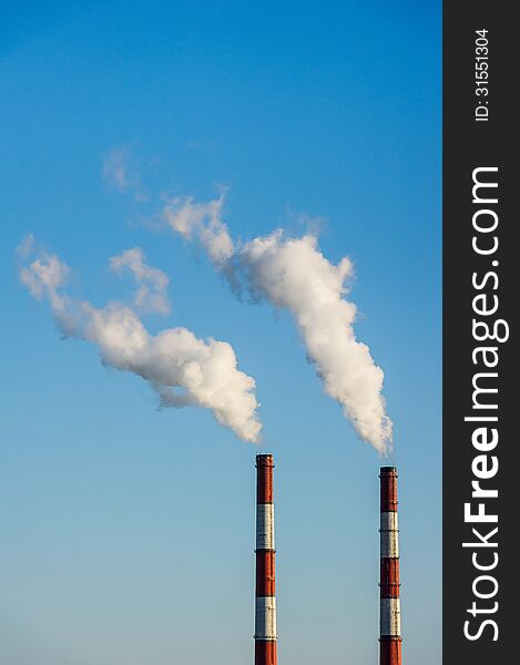 Two factory sky on blue sky background. Two factory sky on blue sky background.