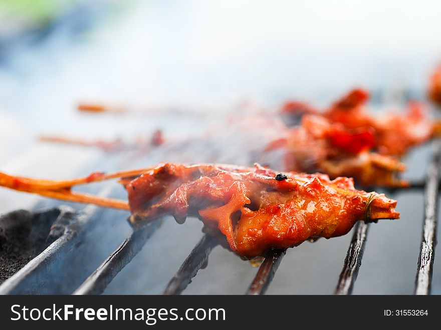 Grilled chicken skewers on the grill